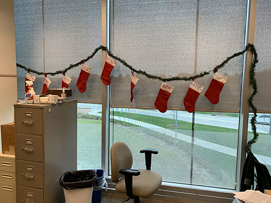 Christmas stockings hung on the windows.
