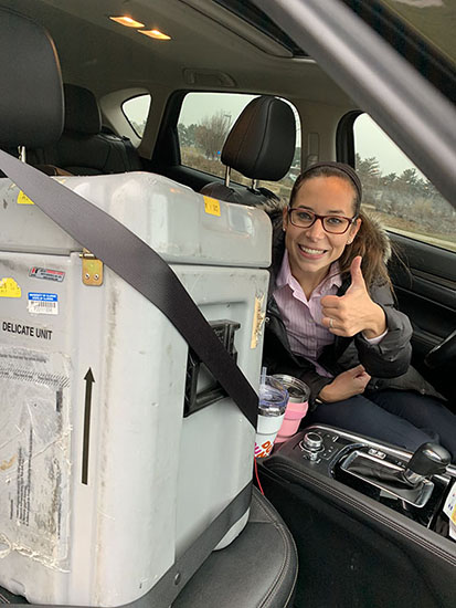 Mackenzie in car with lab crystals.