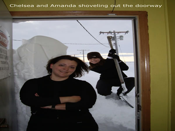 Chelsea and Amanda shoveling out the doorway